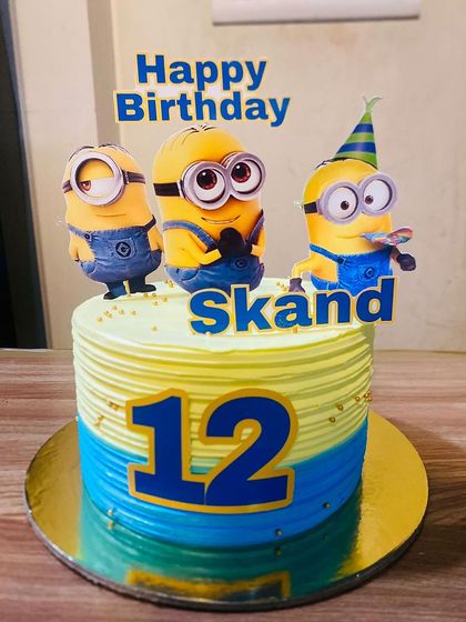 A fun Minions themed cake for a 12th birthday, featuring the cheerful yellow characters.