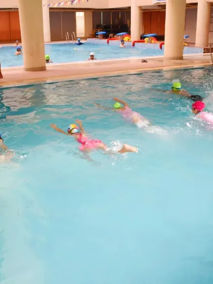 Here you can see a group of my young students practicing their swimming strokes during a class in our indoor heated pool.