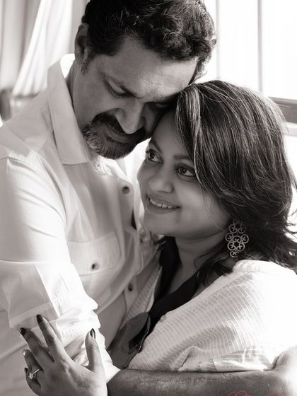 A classic black and white portrait celebrating 25 years of love. The focus is entirely on the couple's enduring connection and the gentle emotion they share.