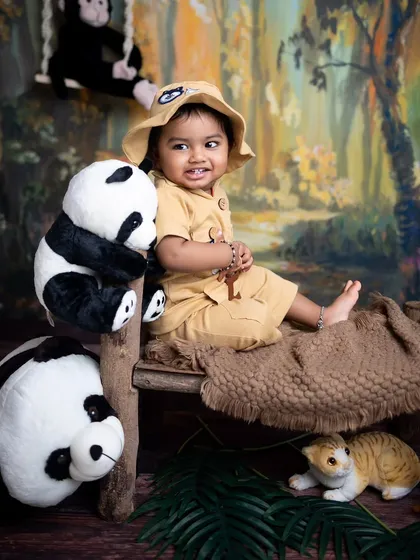 A sweet, curious glance from the little one during his jungle-themed sitter photoshoot.