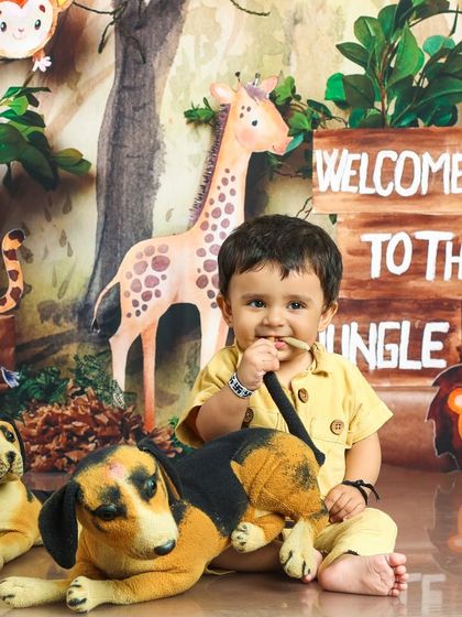 This little adventurer is taking a moment to chew on a stick, just like a real explorer. It's these candid moments that make the best memories.