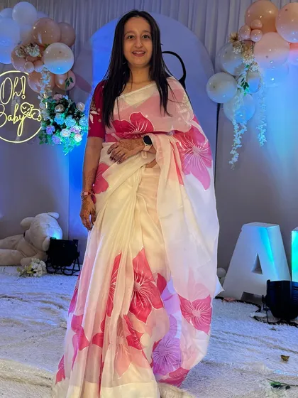 Dressed in a beautiful white and pink floral saree for a baby shower. I love how elegant and graceful a saree feels.