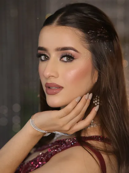This is the ultimate cocktail glam. I created this look with a focus on sophisticated, soft smokey eyes, dewy skin, and a bold nude lip that feels both modern and timelessly elegant.