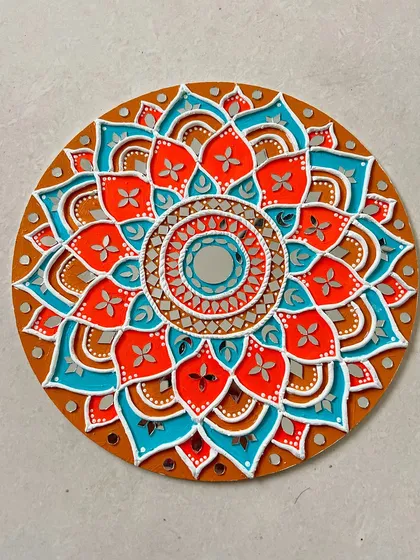 Discover the beauty of traditional Indian crafts with a Lippan art workshop. I'll show you how to use clay and mirrors to create this stunning, intricate mandala piece for your wall.