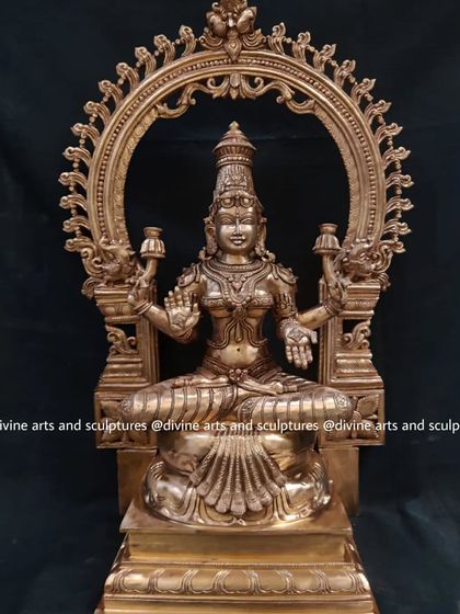 A 23-inch Panchaloha Mahalakshmi statue, complete with an ornate archway. This piece is a perfect example of a complete altar centerpiece.