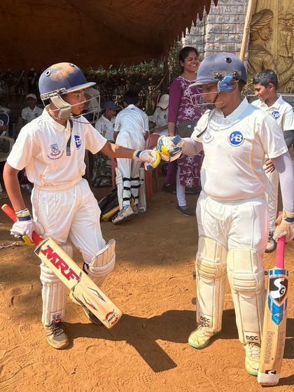 A moment of sportsmanship between two young batsmen during a competitive match, a value we strongly encourage in all our events.