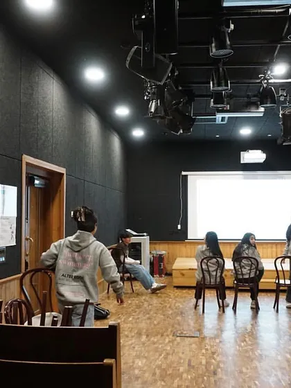The theatre being used by students, a testament to the successful creation of a functional and inspiring 21st-century performance space within a 165-year-old building.