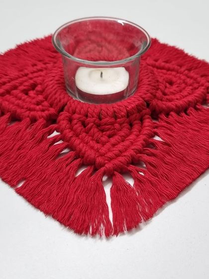 This holder is designed to perfectly cradle a standard glass votive or a traditional diya.