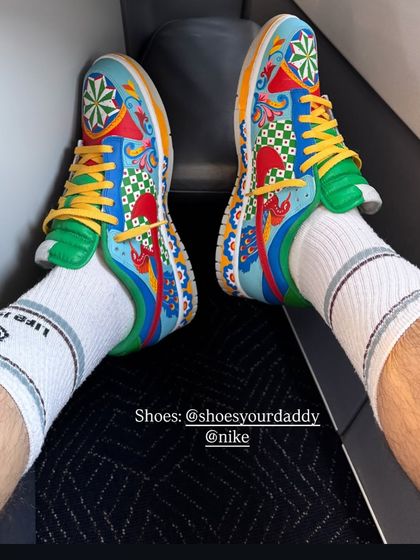It's always amazing to see my art out in the world. Here are the custom Dunks being worn by the artist himself. It’s the best feeling to see my creations become a part of someone's story.