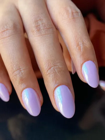 A close-up of the iridescent lavender chrome nails. The color shifts beautifully in the light.