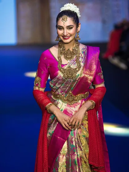 Capturing the energy of the runway for the show stopper at Bangalore Times Fashion Week. This shot highlights the rich colors and textures of the traditional South Indian attire under professional show lighting.