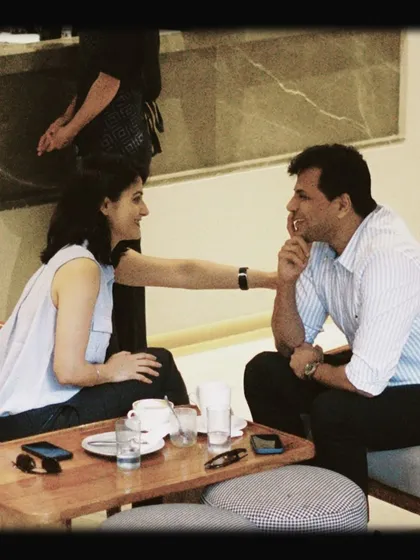 A couple enjoying an intimate conversation at their table. We provide the space for connections to happen.
