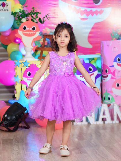 A charming 'Twinkle Twinkle Little Star' themed first birthday party, featuring a soft blue and gold color palette, star-shaped balloons, and a custom backdrop, creating a serene and magical atmosphere.