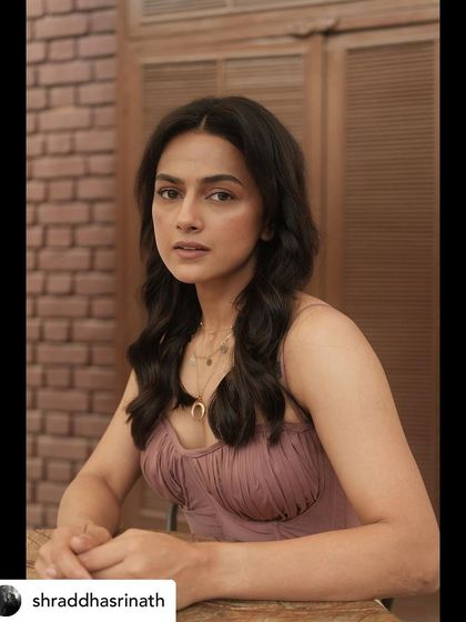 Styling Shraddha Srinath in a soft glam look. This close-up shows the delicate layered necklaces and the gentle waves in her hair, creating an approachable yet chic vibe.