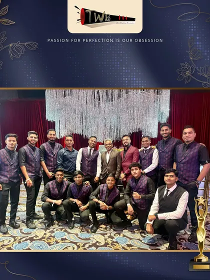 Our large, professional team posing together at an awards ceremony, showcasing the scale and pride of our company.