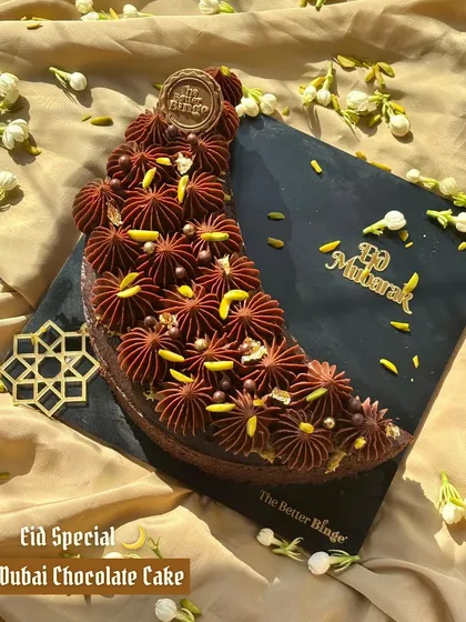 The Eid Special Dubai Chocolate Cake, a crescent of pure indulgence. It's a rich, fudgy delight that celebrates the spirit of the festival.