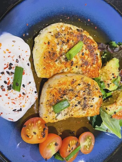 An early, nourishing dinner helps with deep sleep and better energy the next day. This plate of fatty protein from pan-fried paneer, with a side of avocado and cherry tomatoes, is a perfect example of a light yet satisfying evening meal.