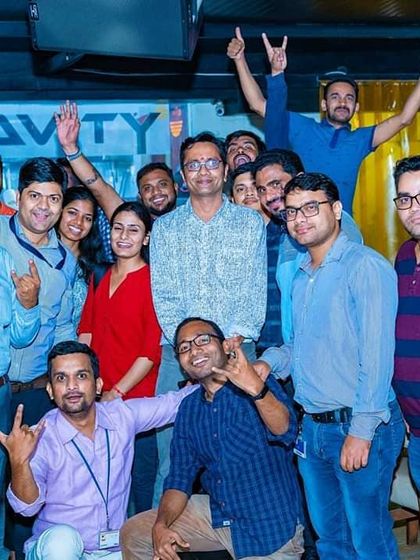 A large group from a corporate outing having a blast on a Wednesday ladies' night at Antigravity Gastropub. It is a great way to build team spirit.