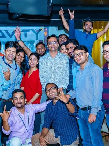 A large group from a corporate outing having a blast on a Wednesday ladies' night at Antigravity Gastropub. It is a great way to build team spirit.