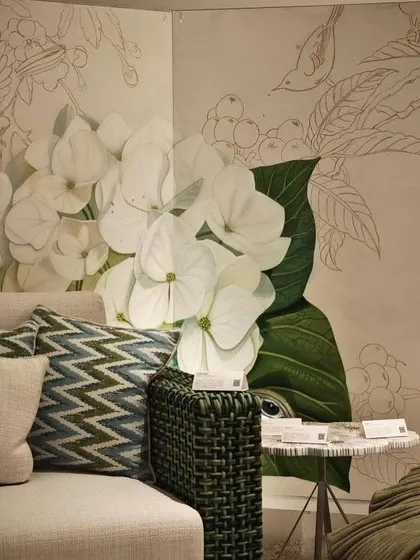 Another view of the collaborative 'A Walk in my Garden' mural, showing the interplay between the fully rendered hydrangeas and the outlined birds and branches.