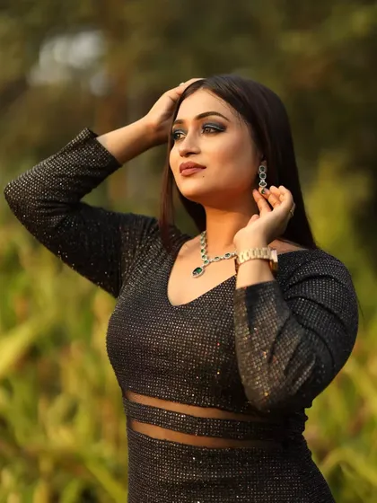 A bold and confident pose. This client is rocking a smokey eye and a shimmery black dress, a perfect combination for a night out.