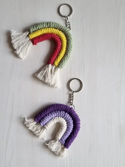 Two more rainbow keychain designs, one in a classic rainbow palette and another in shades of purple.