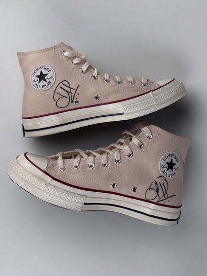 The finished pair of Converse high-tops, signed by Hardik Pandya. The clean design features his signature, making it a prized piece in our collection of celebrity collaborations.