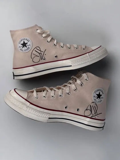 The finished pair of Converse high-tops, signed by Hardik Pandya. The clean design features his signature, making it a prized piece in our collection of celebrity collaborations.