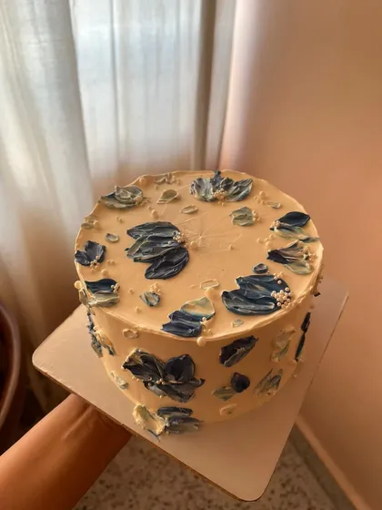 Another angle of the blue palette knife floral cake, showing how the design wraps around the sides.