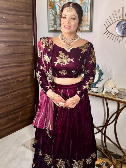 The full look, showcasing the beautiful velvet lehenga and the elegant makeup.