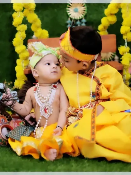Another angle of the two brothers in their Krishna costumes, capturing their loving interaction. Sibling photos are a cherished part of my family newborn packages.