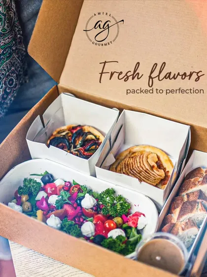 We bring gourmet flavors to your workplace. Our corporate lunch boxes are packed with fresh, wholesome, and nutritious meals, like this one featuring a colorful salad, a savory tart, and fresh bread, to keep your team energized and focused.