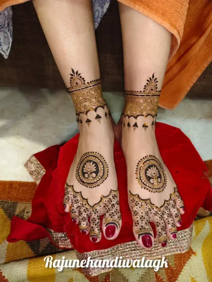 A minimalist yet elegant foot design, with a lotus mandala in the center and simple patterns on the toes and ankles.