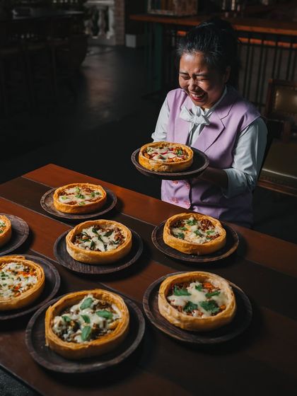 A table full of my Puffizza 2.0 creations, each telling a different story. Our staff's joy is a reflection of the love baked into every one.