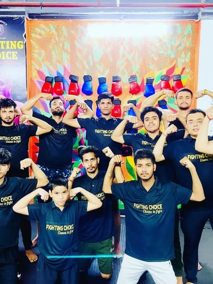 Team flex after a tough workout. Building physical strength is a visible result of the hard work and dedication our members put in every day.