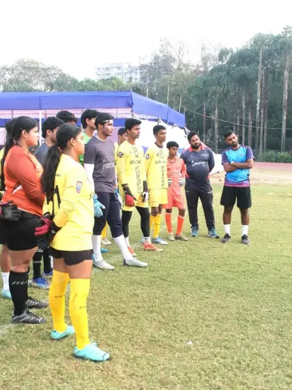 An instructor uses a whiteboard to explain tactical positioning during our specialized goalkeeping clinic. These sessions cover both the physical and strategic aspects of the position for a comprehensive learning experience.
