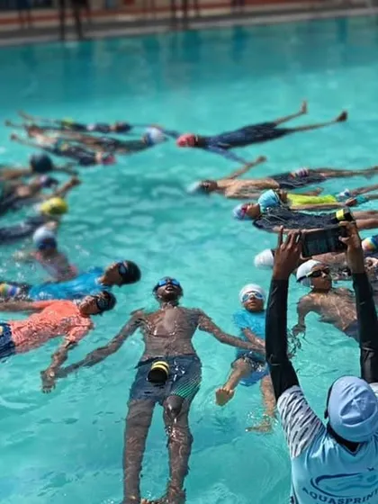 We find calm and balance during our special Aqua Yoga sessions. Here, participants are in a floating Savasana, using the water's natural buoyancy to achieve deep relaxation and release tension.