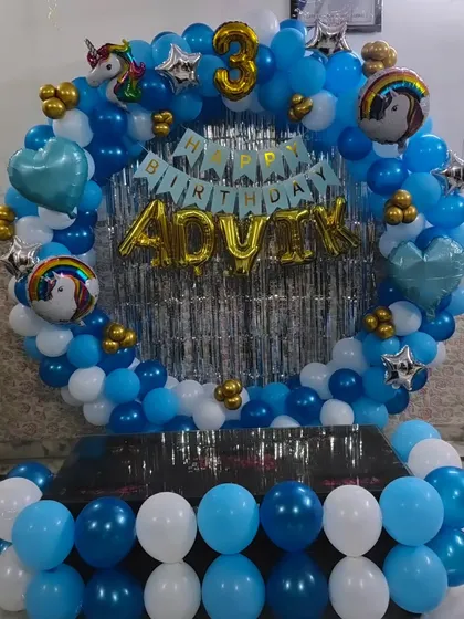 A clear shot of the 'ADVIK' 3rd birthday ring backdrop.