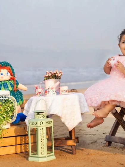 A candid moment during our beach tea party session. We set up a whimsical scene and then let the kids explore and play naturally.