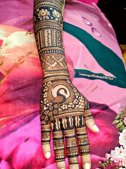 A unique bridal design featuring a peacock on the palm. I love incorporating special motifs like this to make a bride's henna truly one of a kind.
