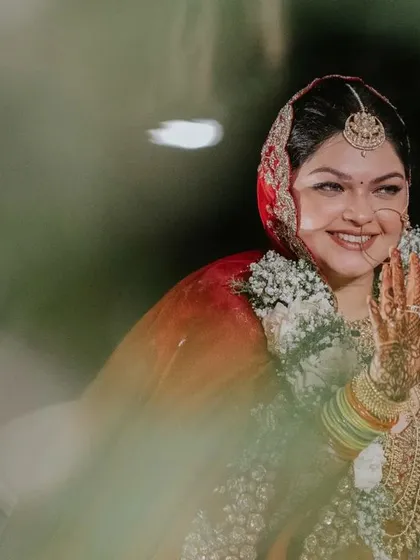 The emotions of a bride are a story in themselves. This candid moment of Ridhi on her wedding day captures the beautiful, hidden feelings amidst the celebration, a quiet poem that we are privileged to witness and frame.