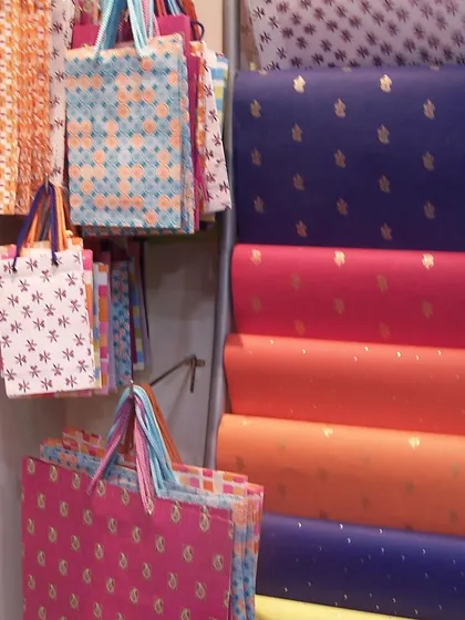 A look back at where it all began in 2003. This was our very first store, filled with colorful gift bags and rolls of handmade paper. Life was simpler then, and so was our shop.