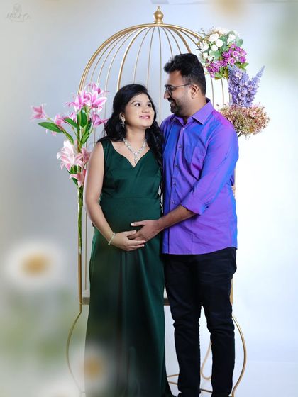 An intimate and loving gaze shared between the couple. This photo, taken with our elegant birdcage prop, focuses on their connection and shared happiness.