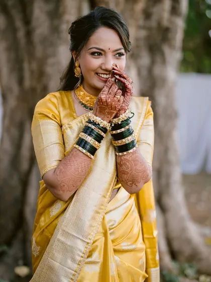 The shy, happy smile of a bride on her wedding day. This candid portrait captures the beautiful emotions of the moment.