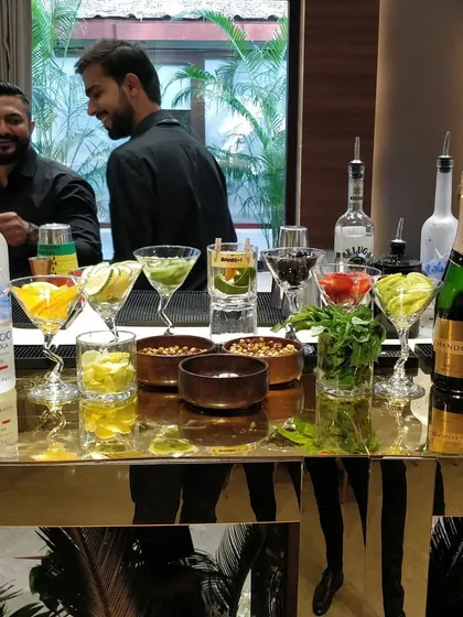 A vibrant and colorful DIY cocktail station. We provide a wide array of fresh garnishes, juices, and premium spirits so guests can have fun creating their own personalized drinks.