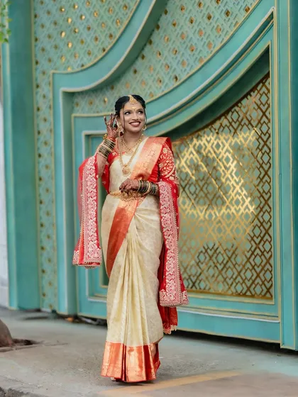 Another shot of our beautiful Telugu bride, showcasing how the pre-pleated saree creates a graceful silhouette. The drape remains perfect even while moving around.