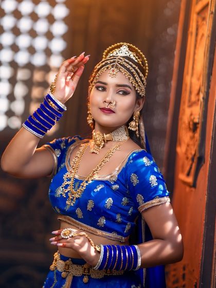 A confident pose from the model, showcasing the entire royal blue ensemble. Our jewellery is a favourite among photographers for themed shoots.