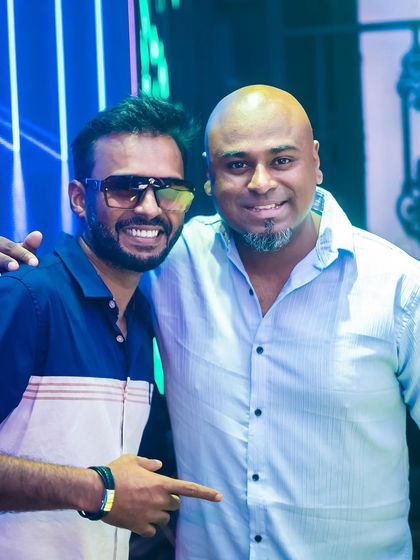 Posing with a friend and fellow event organizer. Collaboration is key to creating great parties.