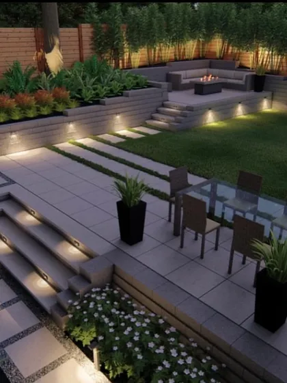 We design multi-level outdoor living areas that are both practical and stylish. This concept shows a combination of lawn, planters, and a paved patio with a dining area and a fire pit lounge, all connected by illuminated steps. It’s about creating different zones for relaxation and entertainment.