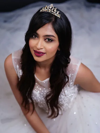 Creating a fairytale moment with this Christian bridal look. The focus was on flawless skin, a romantic berry lip, and soft waves, all topped with a delicate tiara for that perfect princess feel.